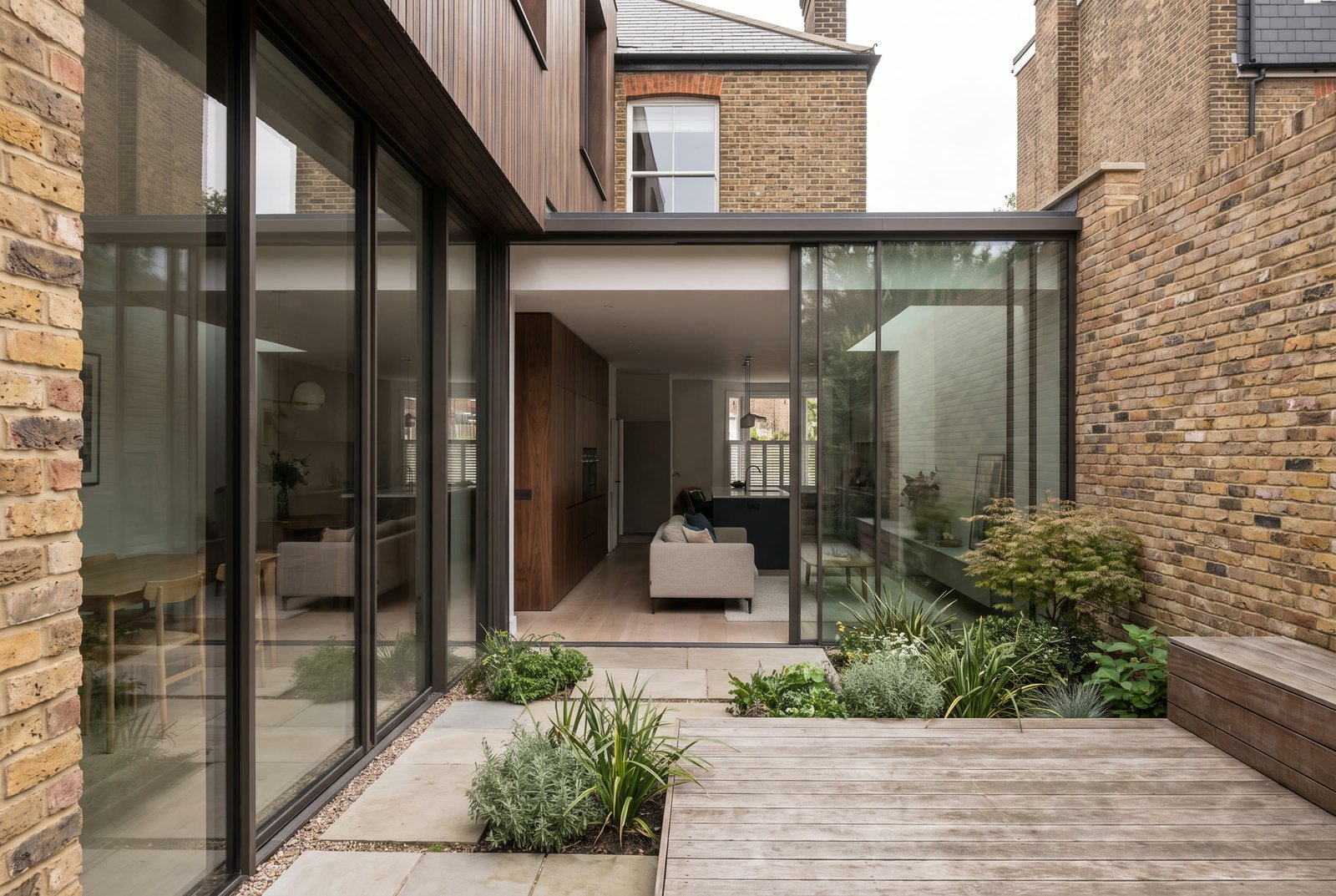 Rear garden facade of Form / 02 with full-height glazing.